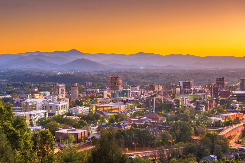 View of Asheville, North Carolina, with mountains in background, at dawn