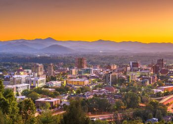 View of Asheville, North Carolina, with mountains in background, at dawn